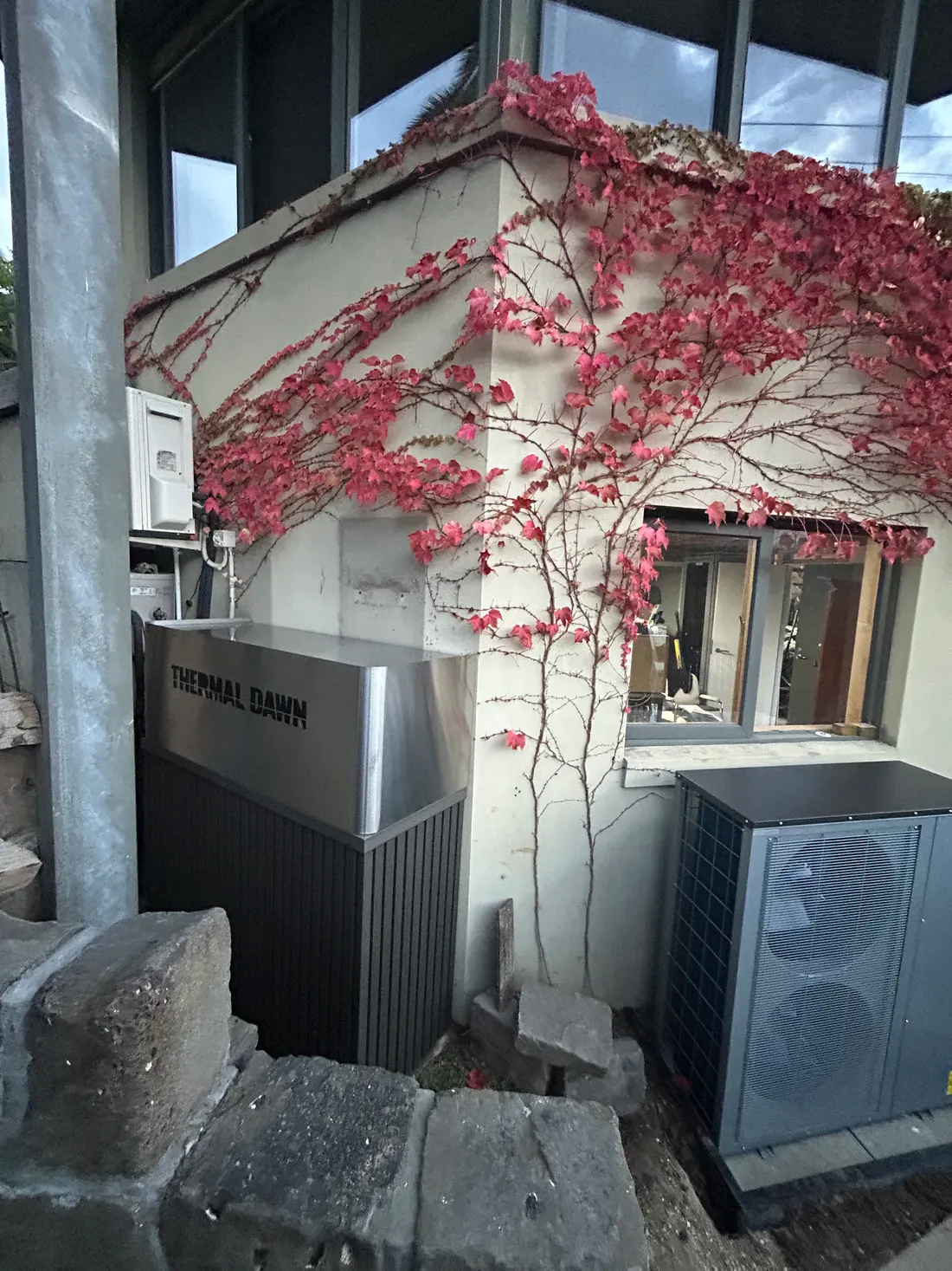 A Thermal Dawn thermal store and heat pump installed against the wall of a home, where the gas boiler used to be