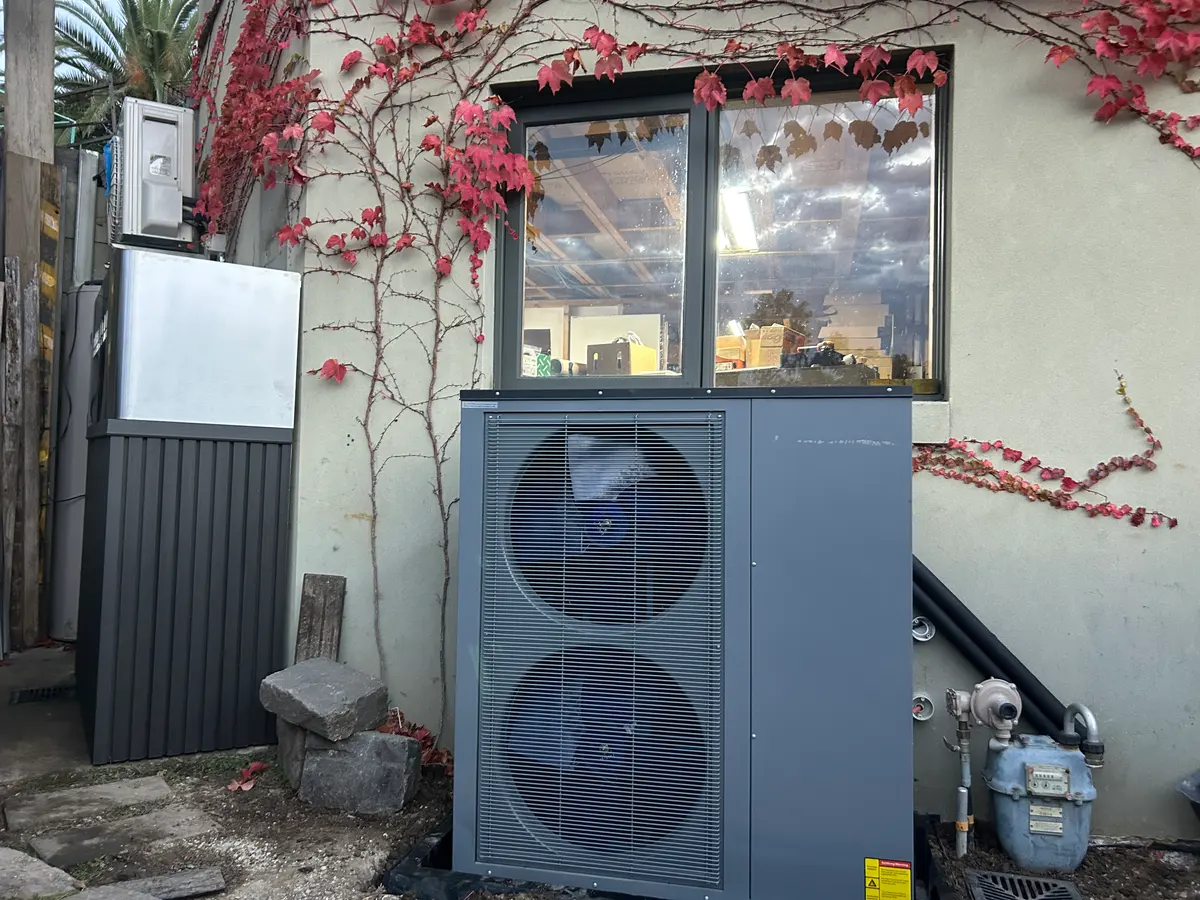 The Thermal Dawn outdoor unit in place against the wall of the Hawthorn home, beside the disconnected gas meter